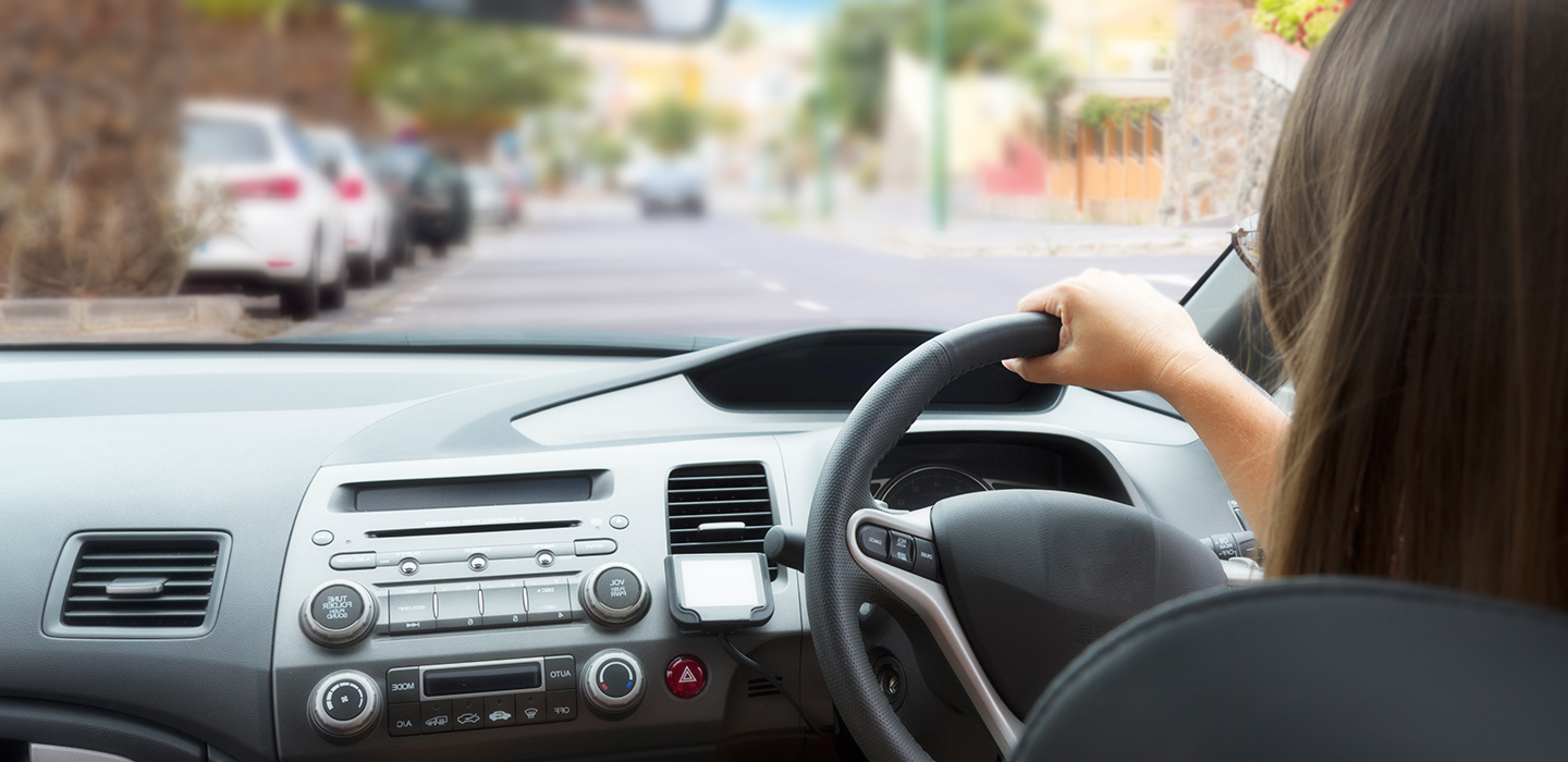 A learner behind the wheel looking at the road